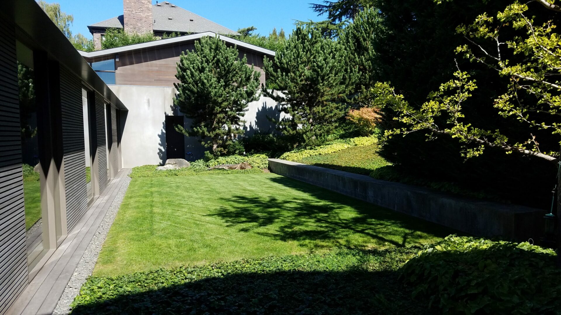 A house with a driveway and a lot of grass